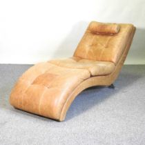 A contemporary tan leather upholstered lounge chair, the Swift daybed, on metal legs, 170cm long