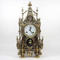 An ornate continental brass cased mantel clock, 20th century, with a twin train movement, striking