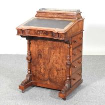 A Victorian walnut davenport, with a pierced brass gallery and inset hinged writing surface 54w x