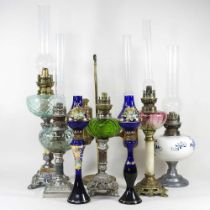 A collection of eight various mainly 19th century oil lamps, highest 64cm overall (8)