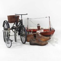 A metal model of a vintage tricycle, 28cm, together with another, a model boat and other items