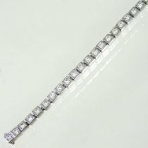 An 18 carat white gold diamond line bracelet, set with a row of square set stones, 3.05 carats