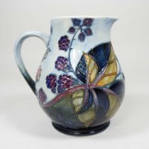 A Moorcroft Bramble pattern pottery jug, impressed marks to base, 14cm high
