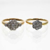An 18 carat gold and platinum daisy set diamond cluster ring, the central stone, surrounded by eight