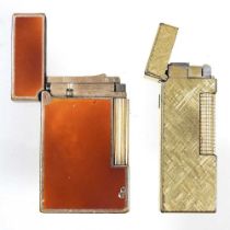 A Dupont brown laque de chine gold plated pocket lighter, stamped marks, 6cm high, together with a
