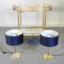 A gilt painted two tier drinks trolley, with mirrored shelves, 82 x 81cm, together with a pair of