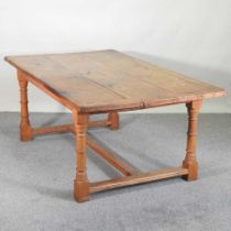 A modern hand made oak refectory dining table, with a plank top, on turned legs 198w x 114d x 77h