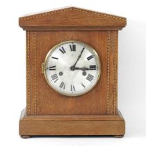 An Edwardian walnut cased mantel clock, 32cm high