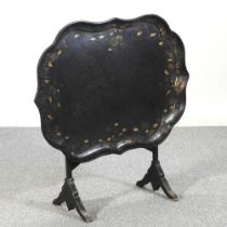 A Victorian black papier mache and inlaid tray, on a folding stand 82w x 63d x 88h cm