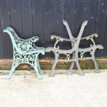A pair of iron bench ends, together with another pair larger, 81cm (2)