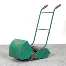 A vintage Webb miniature push along toy lawn mower