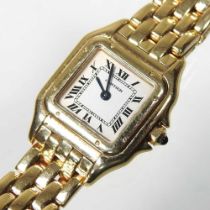 A Cartier Tank 18 carat gold cased ladies wristwatch, the signed 13mm dial with Roman hours, on a