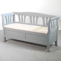 A modern painted pine bench, with a floral upholstered rising seat 151w x 52d x 79h cm