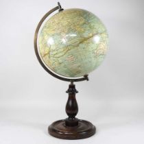 A Bacons Excelsior twelve inch terrestrial globe, on a wooden base