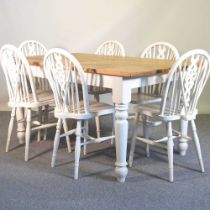 A pine and white painted table, together with six white wheelback chairs (7) 153w x 91d x 77h cm