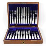 A set of twelve pairs of Victorian silver plated fish eaters, with mother of pearl handles, in a