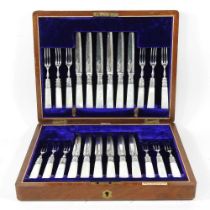 A set of twelve pairs of Victorian silver plated fish eaters, with mother of pearl handles, in a