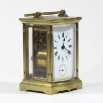 An early 20th century brass cased carriage clock, with a white enamel dial, 11cm high