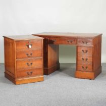 A reproduction yew wood pedestal desk, with a leather inset top, together with a matching filing