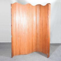 A pine folding screen Approx 200w x 182h cm Looks like a shutter or tambour which has been removed