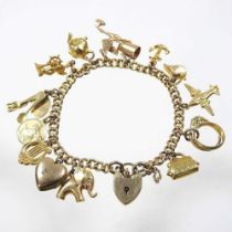 A 9 carat gold curb link charm bracelet, suspended with a collection of fourteen various novelty