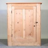 An antique pine meat safe, with metal grille sides and a panelled door 94w x 48d x 114h cm