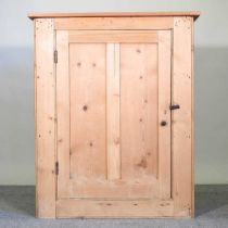 An antique pine meat safe, with metal grille sides and a panelled door 94w x 48d x 114h cm