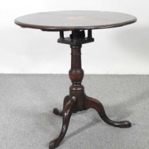 A 19th century and later oak occasional table, with a birdcage action, on a tripod base 75w x 74h
