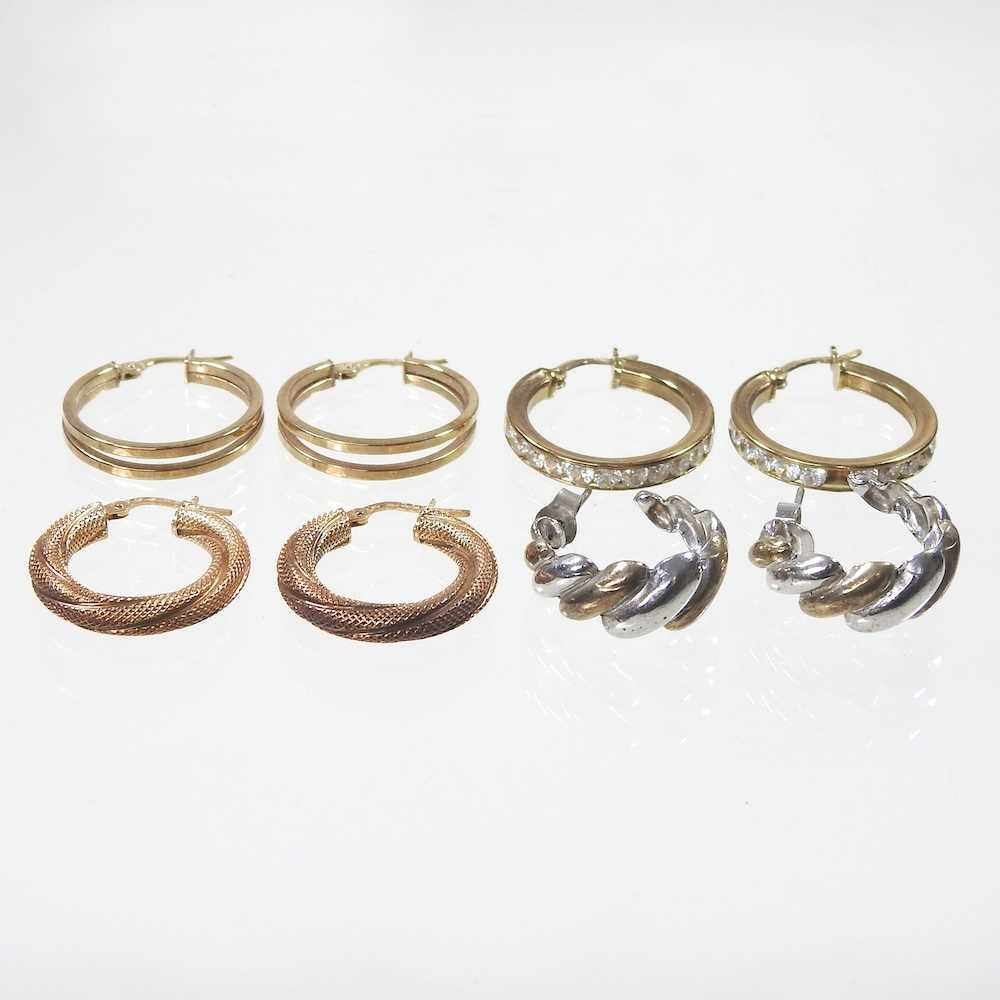 A pair of 9 carat gold hoop earrings, of twisted textured design, 2.4g, 22mm diameter, together with
