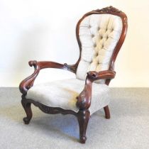 A Victorian walnut cream upholstered button back armchair, 97cm high