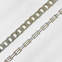 A heavy 9 carat gold curb link bracelet, with a hinged clasp, 30g, 21cm long, together with a gilt