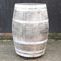 A coopered wooden barrel, 99cm high