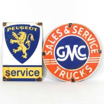 A circular vintage style enamel sign, GMC, together with another, Peugeot, 30cm diameter (2)