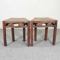 A pair of Chinese carved hardwood side tables, each with brass inlay and carved decoration (2)