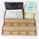A mid 20th century Mah Jong set, with bone tiles and markers, boxed