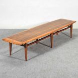 A 1960's Danish style teak coffee table, of tapered rectangular shape, on turned legs, stamped