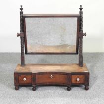 A George III mahogany swing frame toiletry mirror. Note: a non-transferable ivory exemption