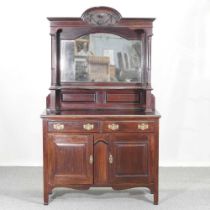An Edwardian mirror back sideboard, with a shelved back and cupboards below 125w x 48d x 196h cm