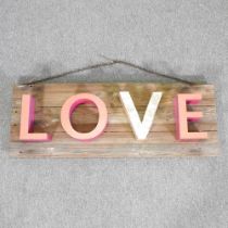 A rustic wooden Love sign, 117cm wide