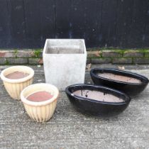 A pair of black garden pots, 50cm wide, together with another pair and another (5)