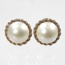 A pair of 9 carat gold cultured pearl earrings, with a ropetwist surround and clip backs, 7g, 14mm