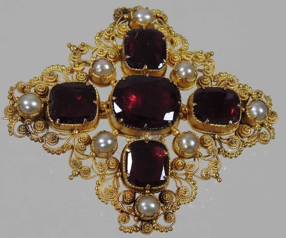 A 19th century unmarked gilt filigree brooch, set with garnets and pearls, with plaited hair inset - Image 2 of 3