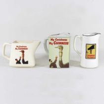 A Guinness advertising water jug, together with two others (3)