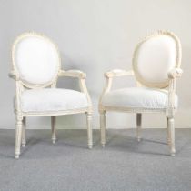 A pair of 20th century French style cream upholstered open armchairs, on turned legs (2) 60cm wide