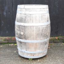A coopered wooden barrel, 99cm high