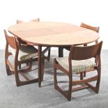 A 1960's teak Danish style dining suite, attributed to Portwood, comprising an oval extending dining