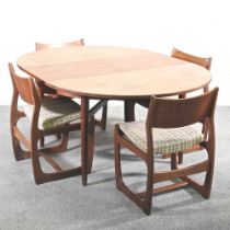 A 1960's teak Danish style dining suite, attributed to Portwood, comprising an oval extending dining