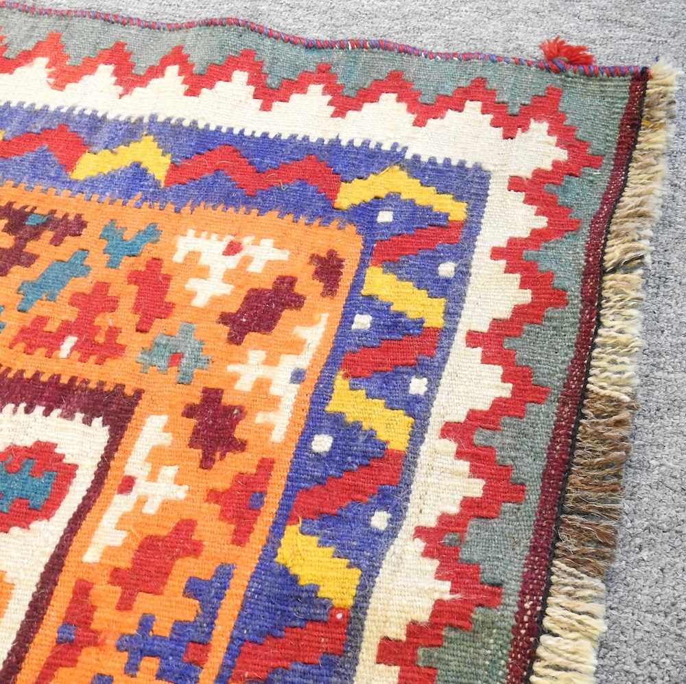 A Persian qashqai kilim, with all over lozenges, on a red ground, 290 x 175cm - Image 3 of 5