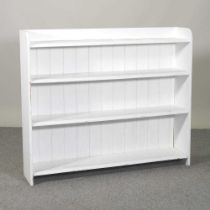 A white painted pine dwarf open bookcase 114w x 23d x 97h cm