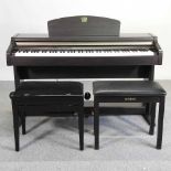A Yamaha electric Clavinova piano, in an ebonised case, together with two piano stools (3) 136w x